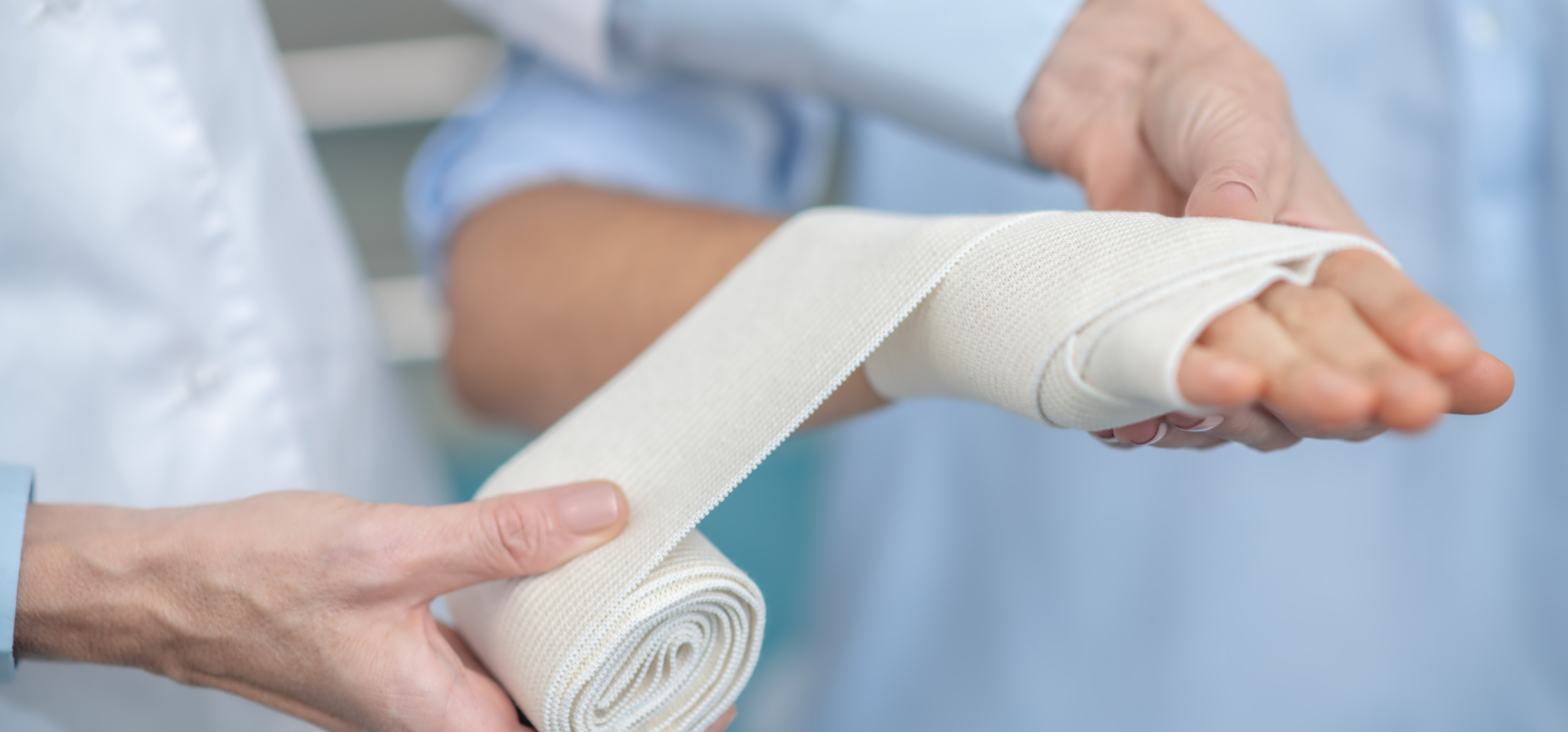 Applying bandage to hand