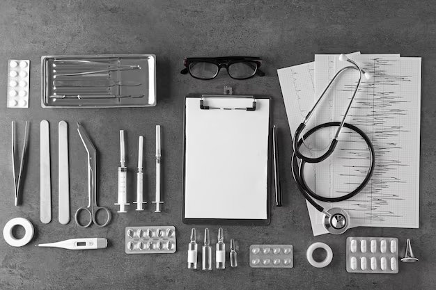 A professional overhead view of medical diagnostic equipment and instruments, including a stethoscope, thermometer, syringes, and a clipboard, laid out for clinical health checks