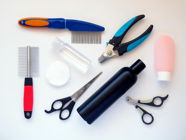 A collection of essential pet grooming supplies for home use, including professional dog combs, nail clippers, scissors, and pet-safe shampoo bottles for daily care
