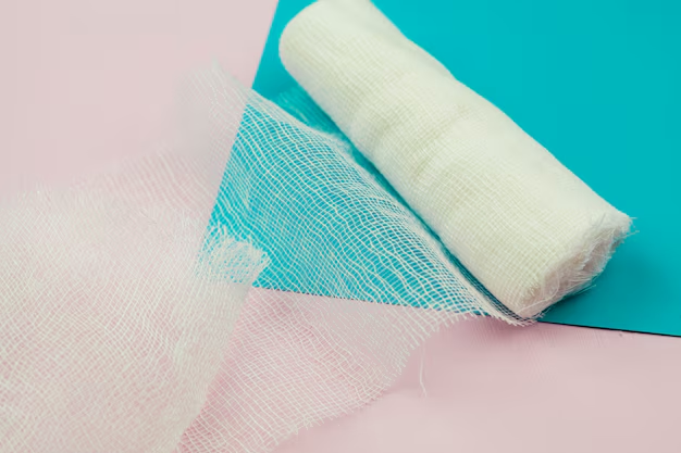 A partially unrolled Livingstone conforming cotton bandage on a multi-coloured background, used for wound dressing and injury support.