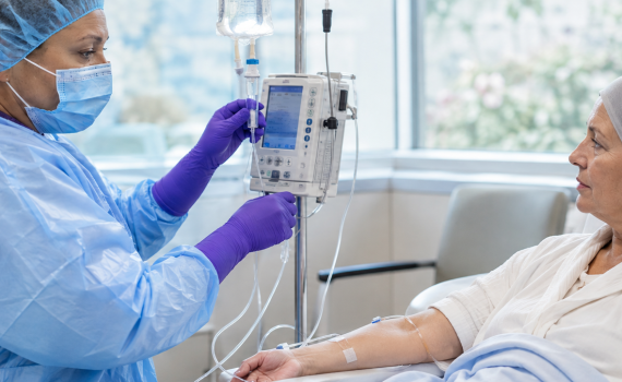 Nurse Managing Patient's IV Infusion