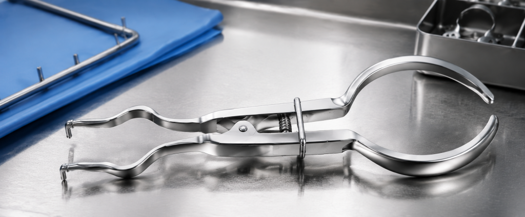 Rubber dam forceps arranged with dental isolation equipment in a clinical setting