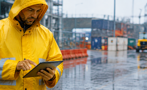  Worker wearing rain coat