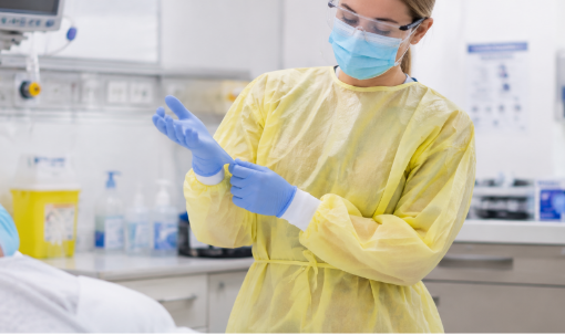 Healthcare worker wearing isolation gown