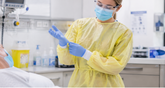 Healthcare worker wearing isolation gown