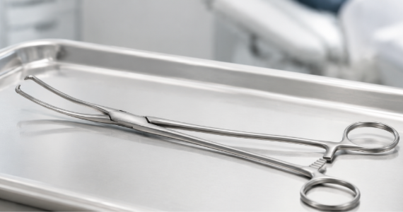 Teale uterine forceps on stainless steel tray