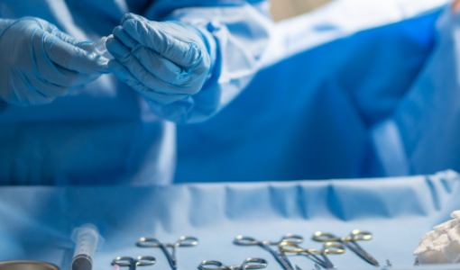 Surgeon selecting straight and curved Potts-Smith dissecting forceps