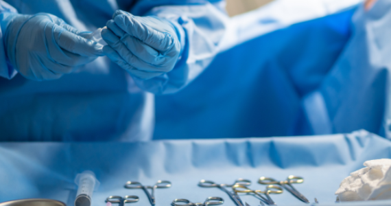 Surgeon selecting straight and curved Potts-Smith dissecting forceps