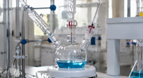 Multi-neck round bottom flasks in a research laboratory.