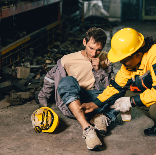 First aider aiding on man's right leg