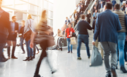 people moving through a busy public indoor space