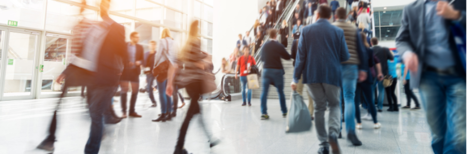 people moving through a busy public indoor space