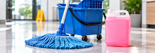 Blue mop and bucket kit beside a bottle of hospital-grade pink disinfectant