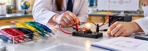A chemistry laboratory setup featuring a bunsen burner heating a flask on a tripod stand, demonstrating how laboratory burners are used for controlled heating experiment