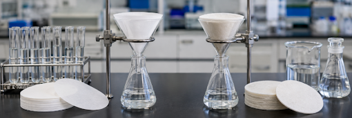 Glass microfiber vs cellulose laboratory filter paper comparison.